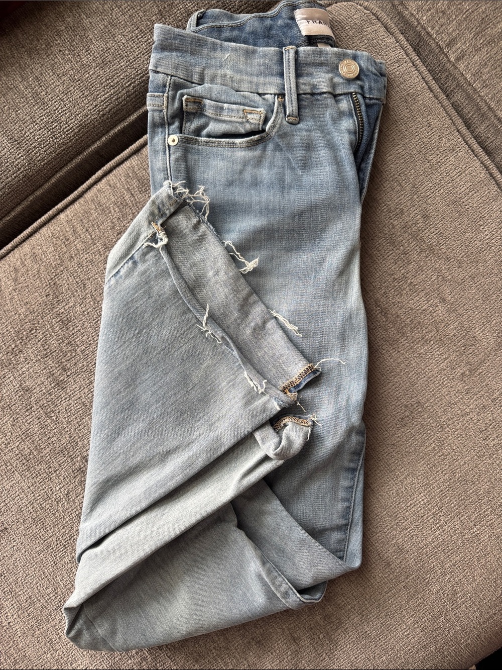 Frame Denim Light Blue Skinny Jeans with Distressed Hem